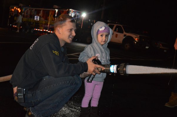  and firefighter Roy Yeager enjoyed the Eastport Fire Department's open house on Friday