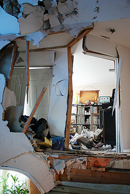 Damage to Mr. Sarli's house after a car crashed into the second floor early Saturday