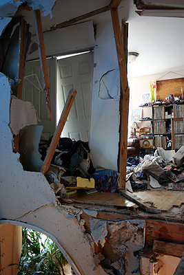 Damage to Mr. Sarli's house after a car crashed into the second floor early Saturday