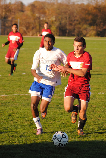Mariner junior Matias Ruiz breaks through a pair of Mattituck defenders.