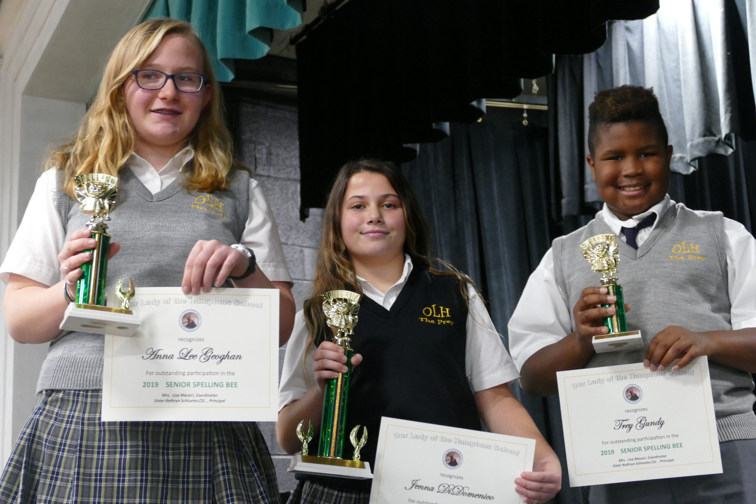 Our Lady of the Hamptons School Prep 6 student Jenna DiDomenico, center, of Hampton Bays was the winner of the school's Senior Spelling Bee. Jenna, who will now represent her school at the Long Island Spelling Bee, bested Prep 8 student Anna Lee Geoghan and Prep 6 student Trey Gundy in the final rounds.