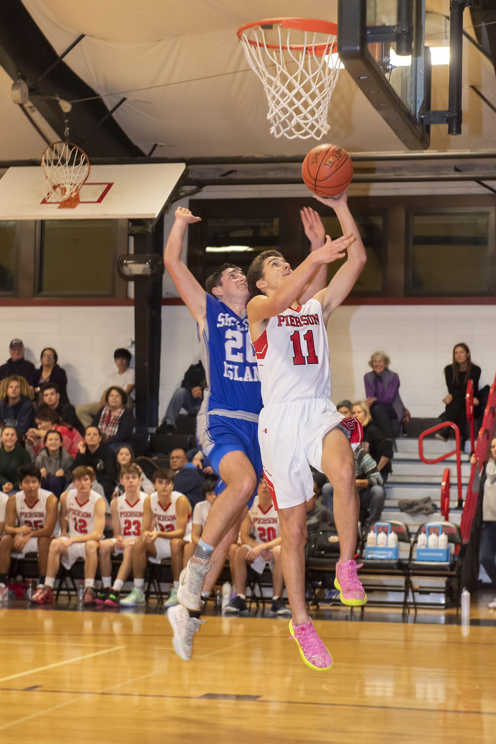 Whaler Nick Egbert blows by a Shelter Island defender for a layup.