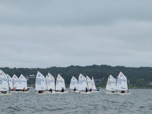 The 420s let their spinnakers out. SARAH WARREN
