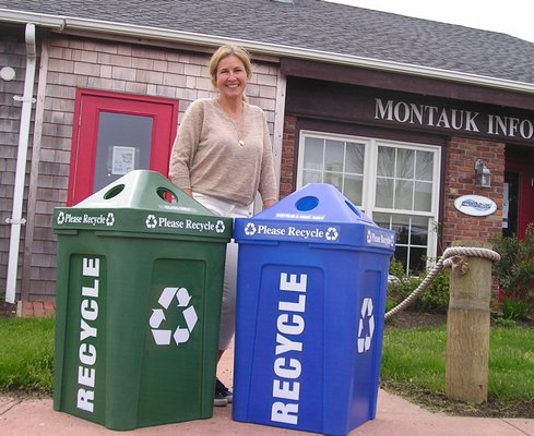 Catherine Foley with two of the recycling containers to go on Montauk's Main Street this summer BY VIRGINIA GARRISON
