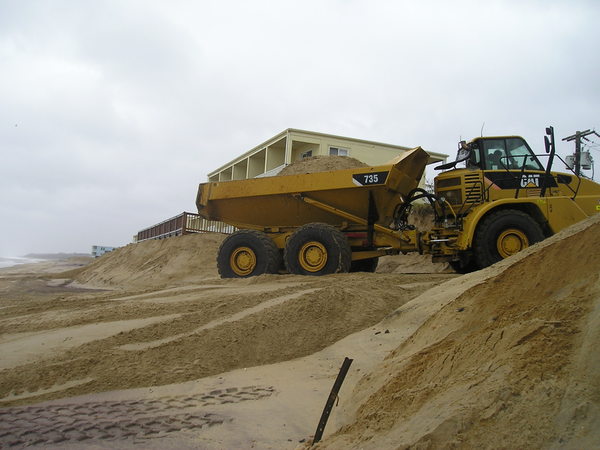 Moving sand on the ocean beach in Montauk on Thursday. VIRGINIA GARRISON