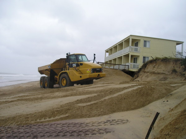 Moving sand on the ocean beach in Montauk on Thursday. VIRGINIA GARRISON