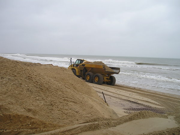 Moving sand on the ocean beach in Montauk on Thursday. VIRGINIA GARRISON