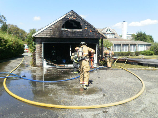 Members of The Westhampton Beach Fire Department  put out a fire after  Hurricane Irene. COURTESY WHB FIRE DEPARTMENT