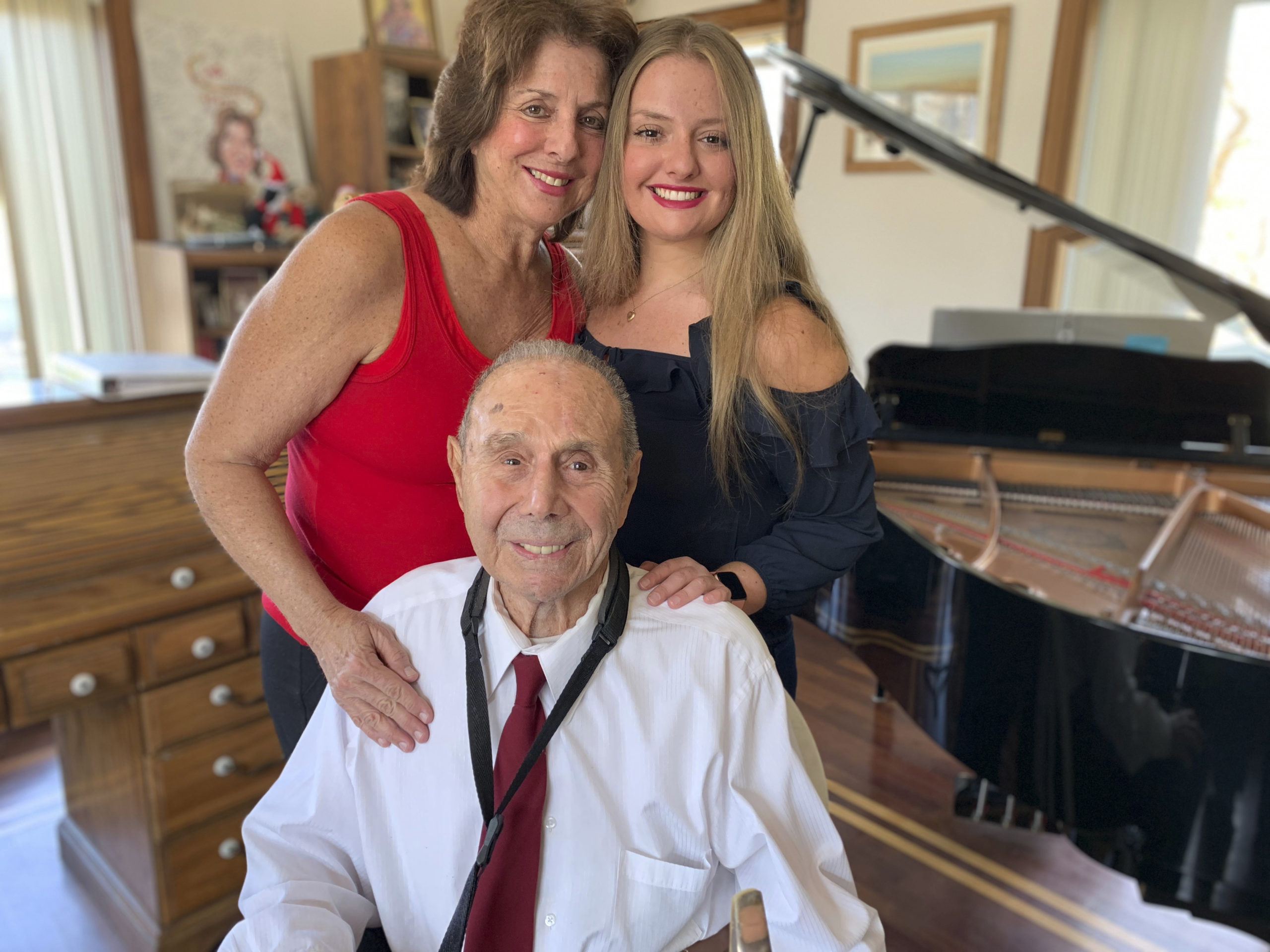 At 97, Montauk Sax Player Is Going Strong 
May 9 -- Montauk nonagenarian Pat DeRosa is a wailing sax man who, after a lifetime of making music, showed no signs of slowing down when interviewed at his home last spring. “I’m now 97 and still playing,” confided DeRosa. “I began playing in Brooklyn when I was 12. I started with the saxophone I got on Dekalb Avenue and I used to take lessons in the Bowery. It was pretty rough at the time and my mother would take me in.” These days, DeRosa lives with his daughter, Patricia DeRosa Padden, and granddaughter Nicole DeRosa Padden, who are also both musically-inclined. Together, they are The Pat DeRosa Jazz Orchestra and the trio performs frequently at venues across the East End. Over the years, DeRosa played with all the jazz greats and making music with legendary musicians, including John Coltrane, has been a way of life for the better part of a century. But still, one goal remains elusive — playing onstage alongside Billy Joel. Last we heard, DeRosa, who recently turned 98, was still hoping to join the Piano Man on stage at some point, and he continues to play regularly, just to stay in fine form. “Saxophone is keeping me young, busy and it’s good for my lungs,” said DeRosa. Billy Joel, we hope you’re listening.