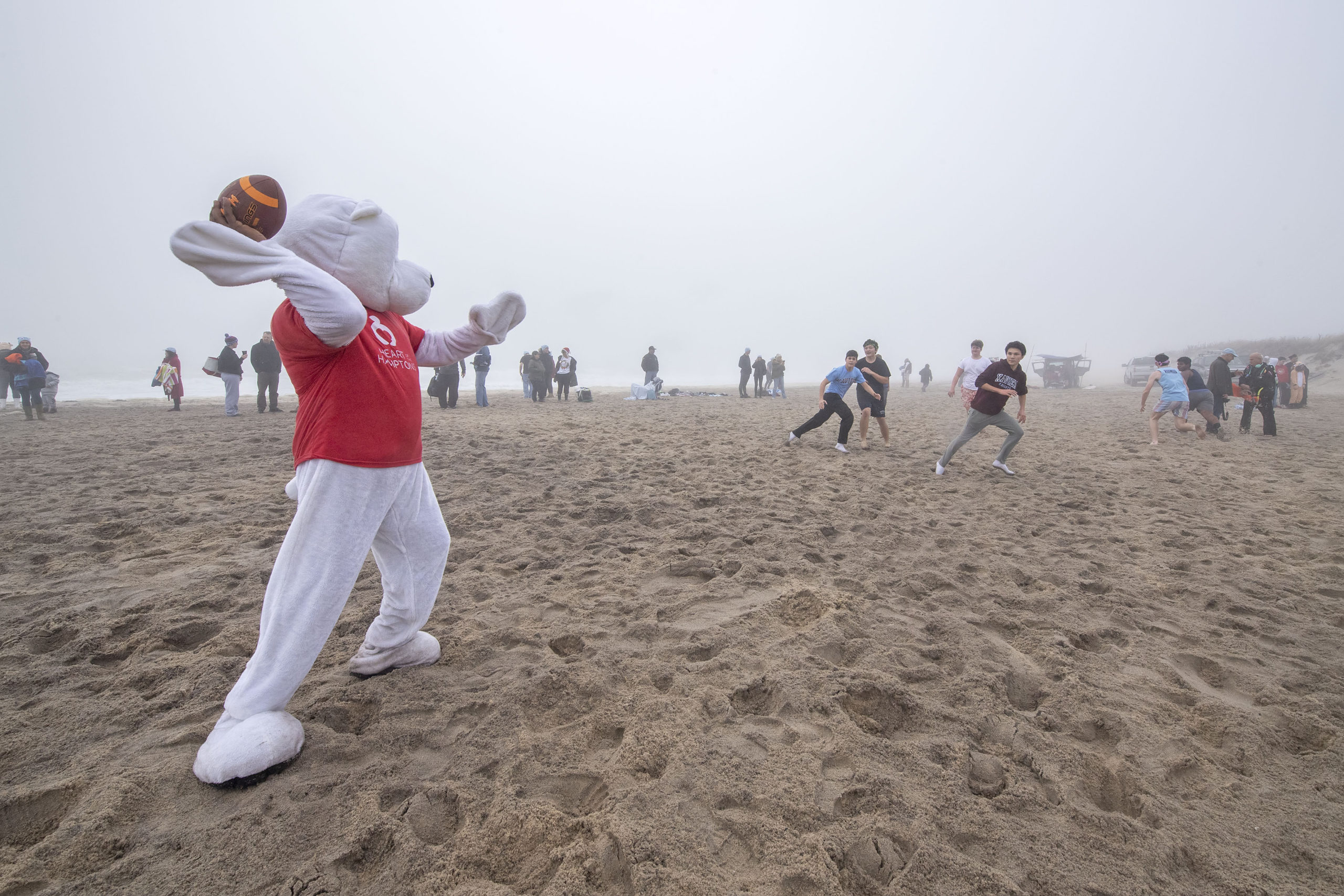 Heart of the Hamptons Polar Bear Gabriel Narvaez subs as Quarterback in a pickup beach tag football game during the 2019 Heart of the Hamptons Polar Bear Plunge at Coopers Beach in Southampton on Saturday morning.