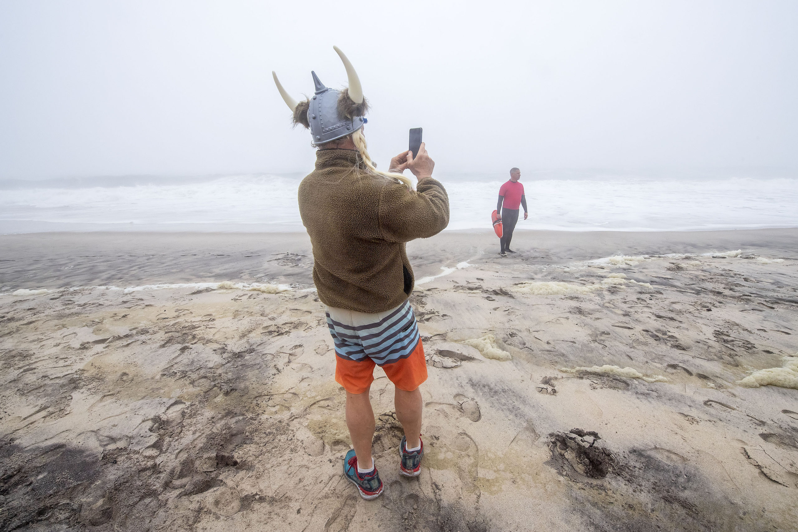 Carl Berglin takes a photo of the foggy waves during the 2019 Heart of the Hamptons Polar Bear Plunge at Coopers Beach in Southampton on Saturday morning.