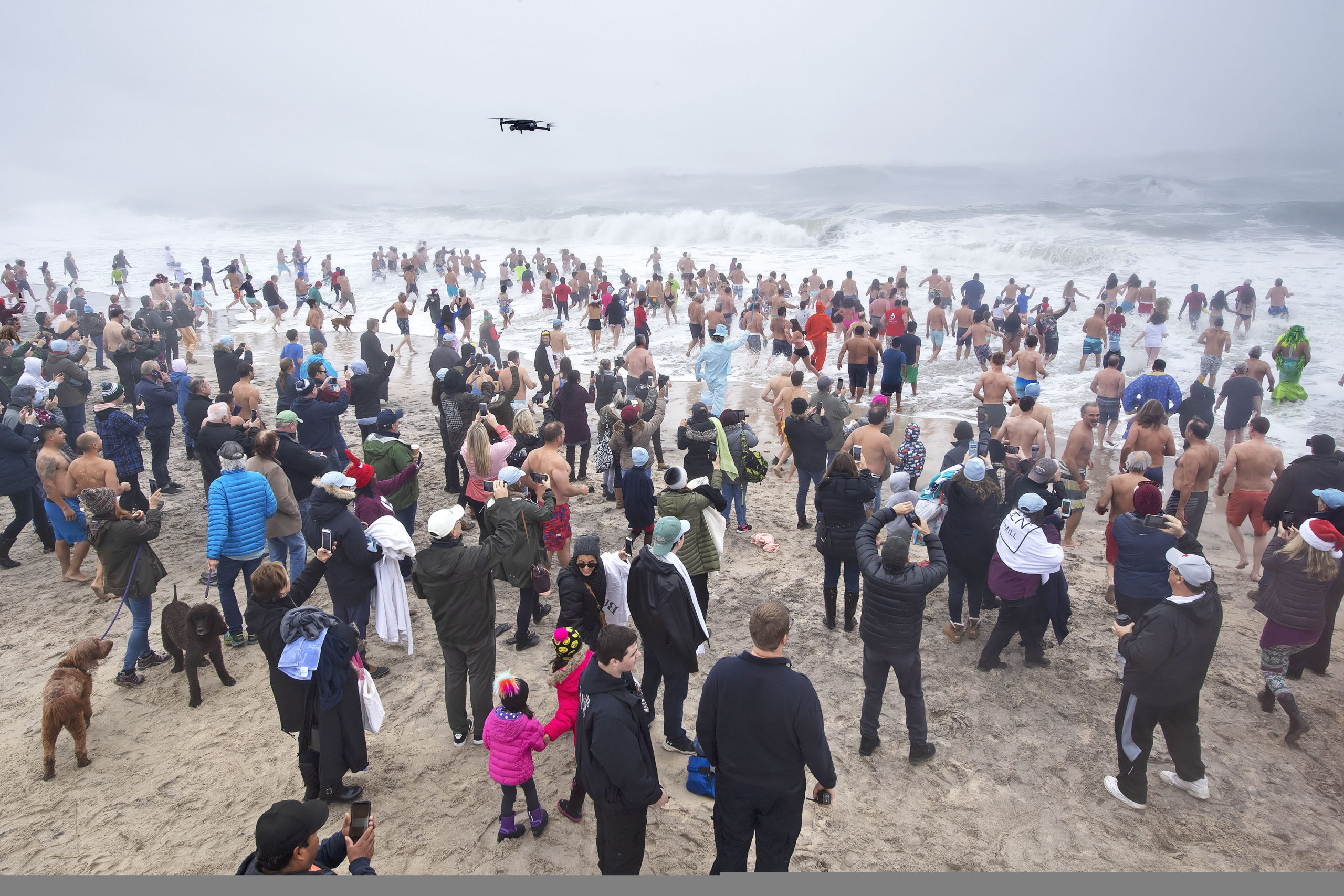 Hundreds of brave swimmers take to the water during the 2019 Heart of the Hamptons Polar Bear Plunge at Coopers Beach in Southampton on Saturday morning.