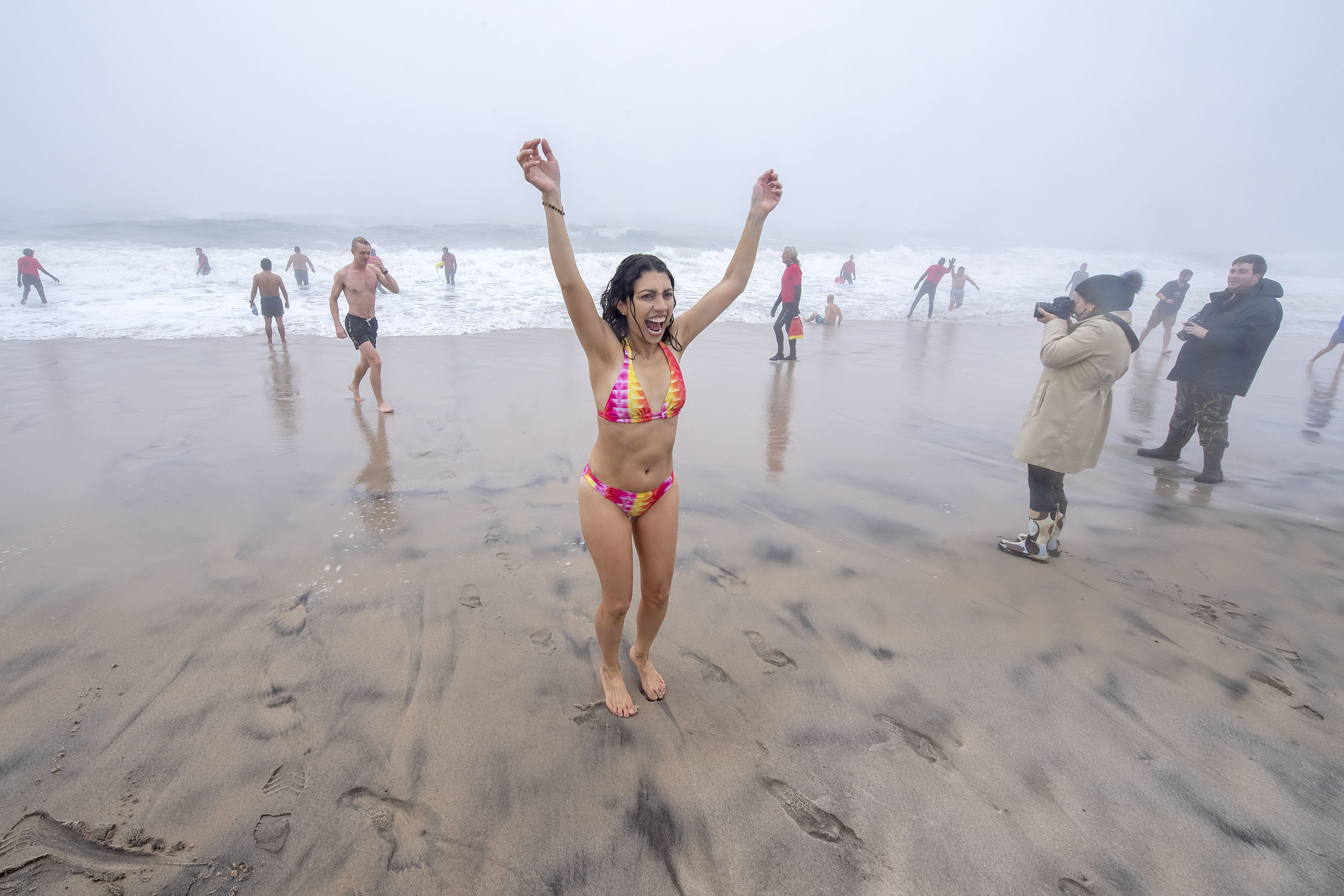 Jazmin Torres celebrates as she leaves the water during the 2019 Heart of the Hamptons Polar Bear Plunge at Coopers Beach in Southampton on Saturday morning. 