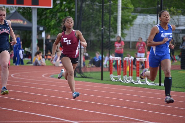 East Hampton's Amanda Calabrese runs in the 100-meter hurdles. DREW BUDD