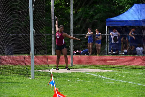 Taliya Hayes of East Hampton gets set to throw the discus. RICCI PARADISO