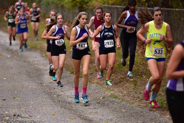 Christina Pasca (467) leads teammate Chloe Haynes (463) early in Friday's race. Haynes wound up being the first Lady Bayman to cross the finish line. DREW BUDD