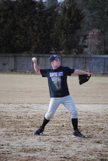 Robbie King makes a throw in practice.
