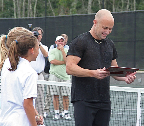 Tennis great Andre Agassi was honored at the Ross School's Grand Slam cellebrity tennis exhibition on Sunday.