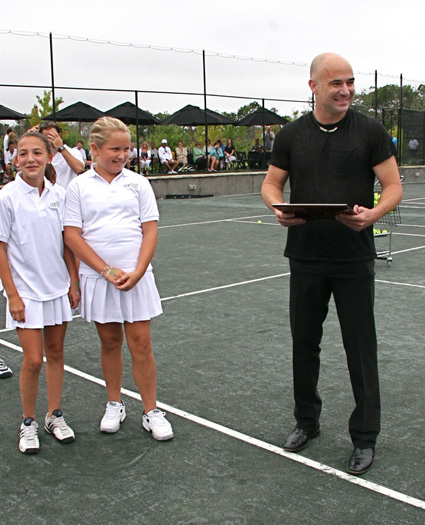 Tennis great Andre Agassi was honored at the Ross School's Grand Slam cellebrity tennis exhibition on Sunday.