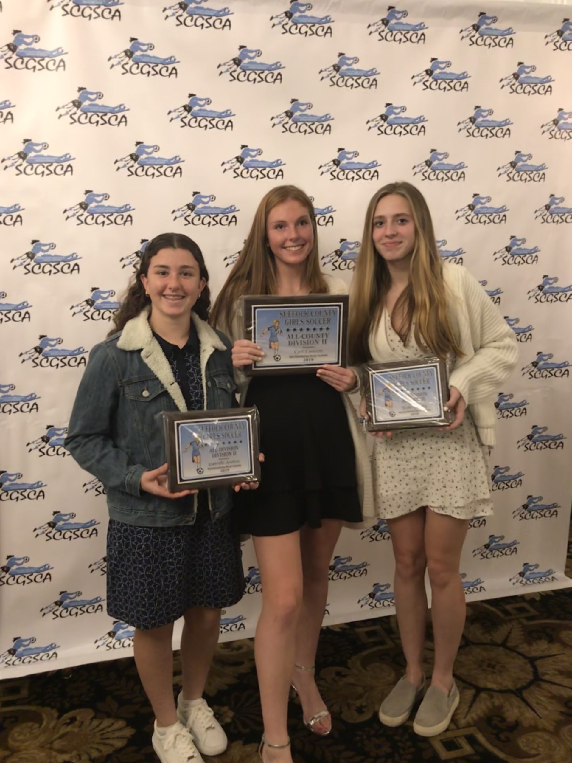 Southampton High School girls varsity soccer players, from left, Ellie Avallone, Carli Cameron and Taylor Zukowky were recognized at the Suffolk County Division II Awards Dinner on November 26 at Villa Lombardi’s in Holbrook. Avallone and Zukosky received All-Division awards, while Cameron was honored with All-County.