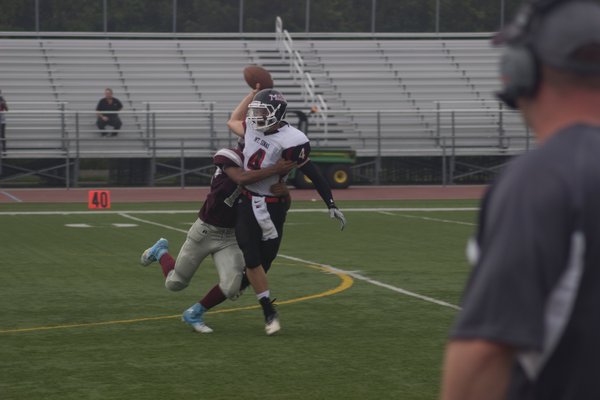 Sophomore Jordan Johnson sacks Mount Sinai's quarterback. RICH MOREY