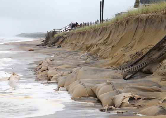 Waves from last month’s strong storm uncovered sandbags from a portion of the U.S. Army Corps’ Downtown Montauk Emergency Stabilization Project. KYRIL BROMLEY