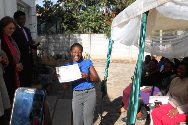 Sithabisiwe Ngwenyareceives her diploma in counseling.