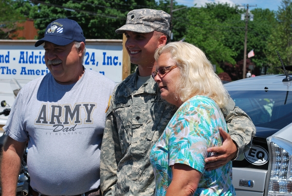  family and American Legion members as he returned from a tour of duty in Iraq on Saturday morning.