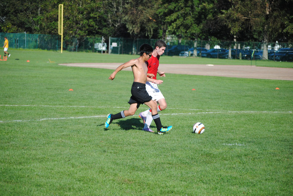 Dan Thompson (right) tracks down a bounding ball during a pre-season drill. 