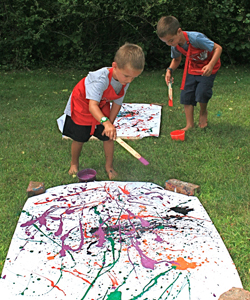 Blake and Jake Turkington work on a joint project at a  drip-painting workshop for children on Saturday at the Pollock-Krasner House offered by Joyce Raimundo.