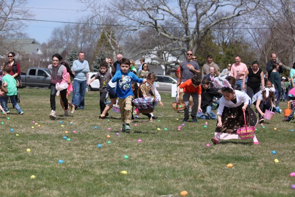 Emma Stork tries to keep her ears on as she searches for eggs at the Greater Westhampton Chamber of Commerce’s 18th annual Egg Hunt to begin on the Great Lawn on Saturday