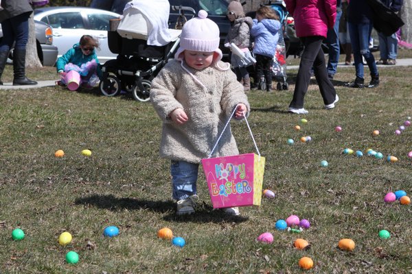 Brooke Donohue and Alina Murphy check out their eggs at the Greater Westhampton Chamber of Commerce’s 19th annual Egg Hunt on Saturday