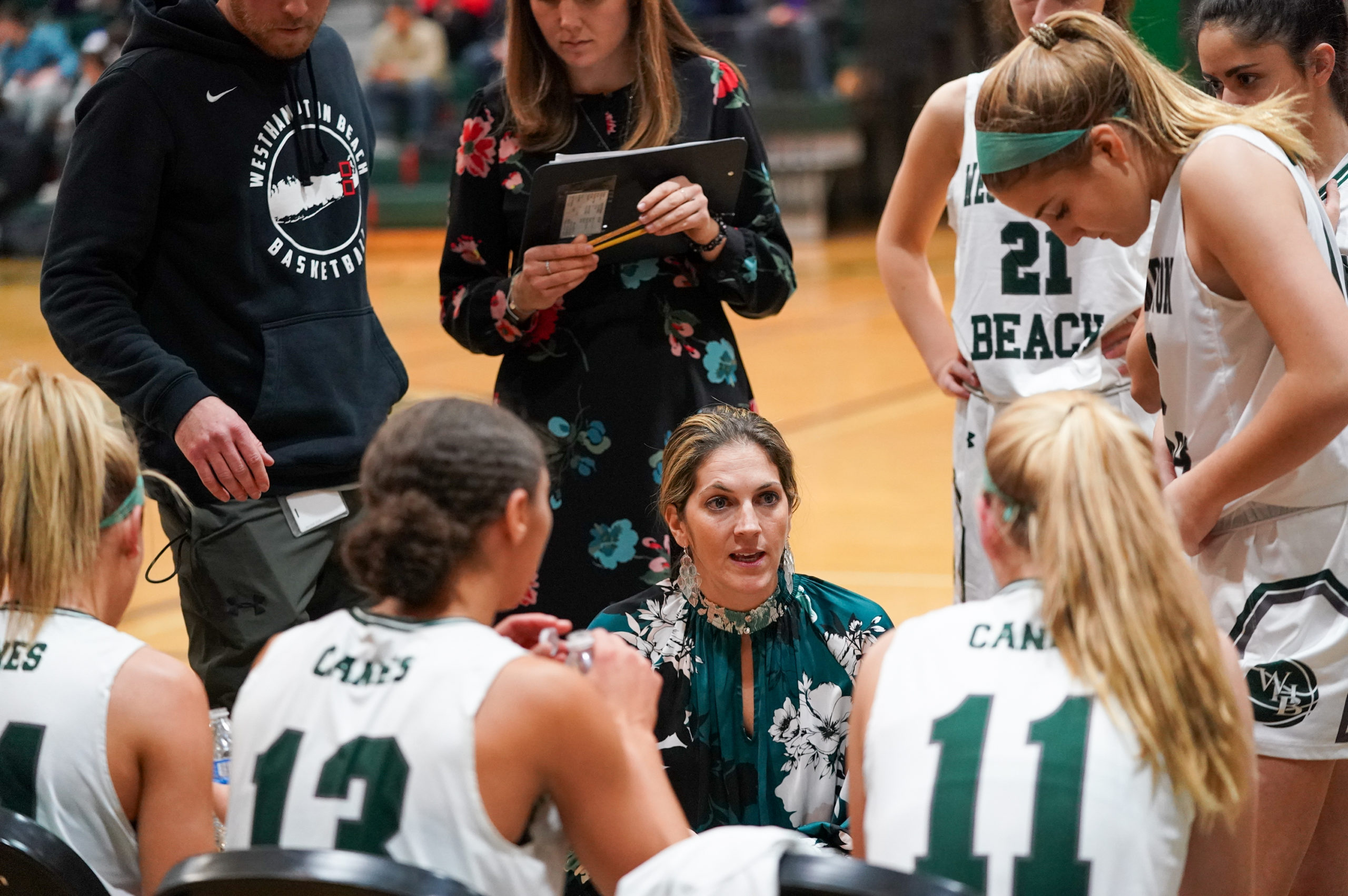 Westhampton Beach head coach Katie Peters speaks to her team during a timeout on December 18.