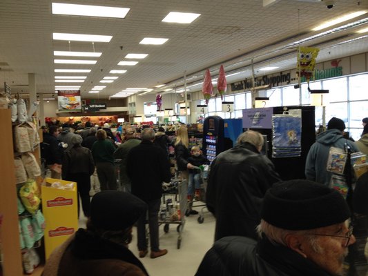 There were long checkout lines at the Waldbaum's supermarket in Southampton Village on Tuesday as people stocked up for the storm. BY DANA SHAW