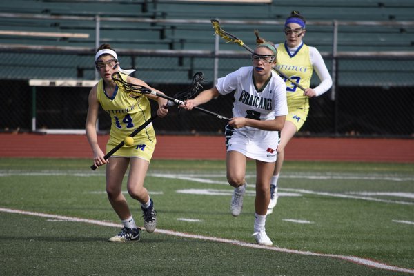 Westhampton Beach freshman Isabelle Smith and a Mattituck player go after a loose ball. DREW BUDD