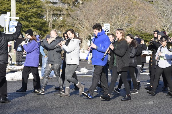 The Westhampton Beach High School Marching Band starts the Parade of Champions for the Westhampton Beach football team down Main Street on Saturday afternoon. DREW BUDD