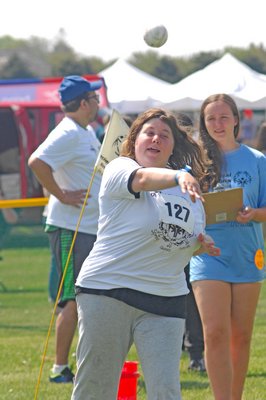 Elizabeth Gaschott comptes in the softball throw competition in which she earned a gold medal.