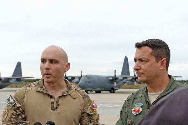 106th  Rescue Wing members Captain Patrick Harding and Major Jeff Cannet speak to the press on Saturday afternoon.  DANA SHAW
