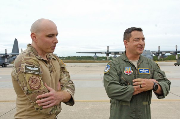 106th  Rescue Wing members Captain Patrick Harding and Major Jeff Cannet speak to the press on Saturday afternoon.  DANA SHAW