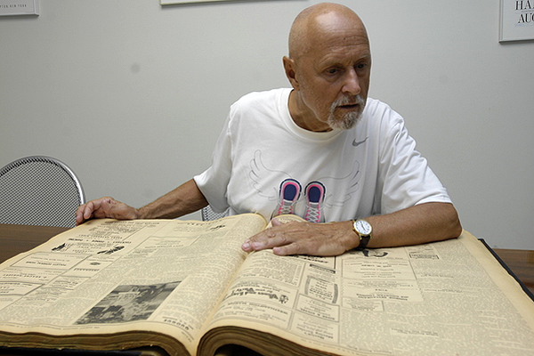 Rene DeBenedette searches for news articles relating to his grandfather's death.  DANA SHAW