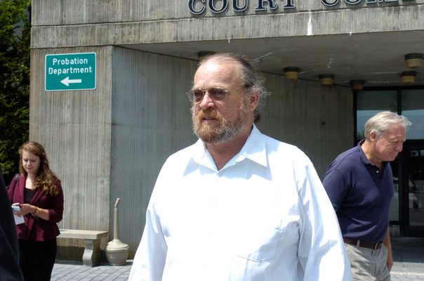 George Guldi leaves the criminal court building in Riverside on Wednesday morning.  DANA SHAW