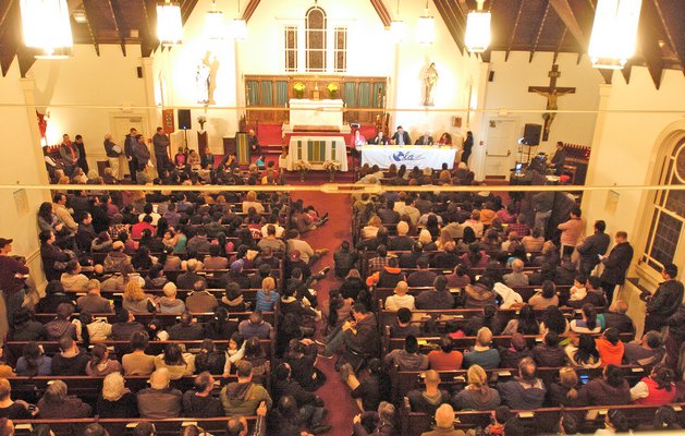 Hundreds of people packed the Queen of the Most Holy rosary Church in Bridgehampton on Tuesday evening for a forum hosted by OLA.  DANA SHAW