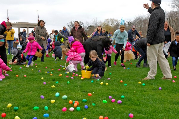 Children scramble for eggs at the Southampton Village PBA Easter Egg hunt on Friday morning.
