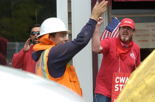 Striking Verizon employees protest work being done by a non-union crew on Jobs Lane in Southampton Village on Wednesday