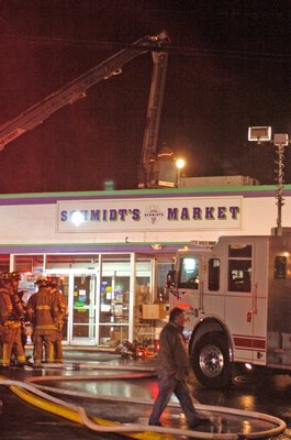 Firefighters respond to a call at Schmidt's Market on Sunday night.  DANA SHAW