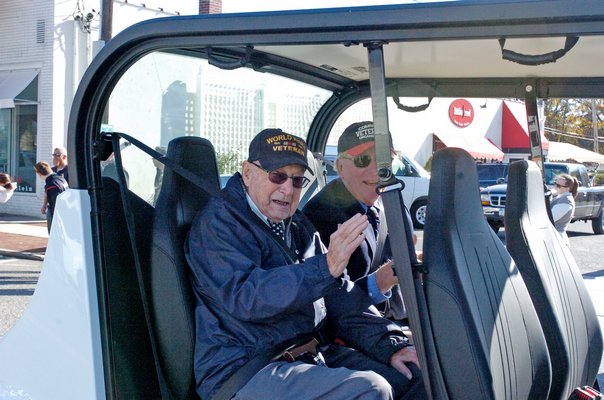 Local residents applaud and show respect to their veterans during the Sag Harbor Veterans Day Parade on Friday