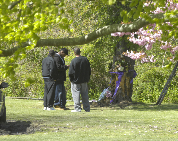 Mourners gather at the site of the fatal crash on the Shinnecock Indian Reservation on Saturday morning. A vigil was held.  DANA SHAW 