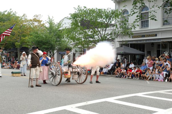 The Southampton Colonial Militia sets off the cannon.