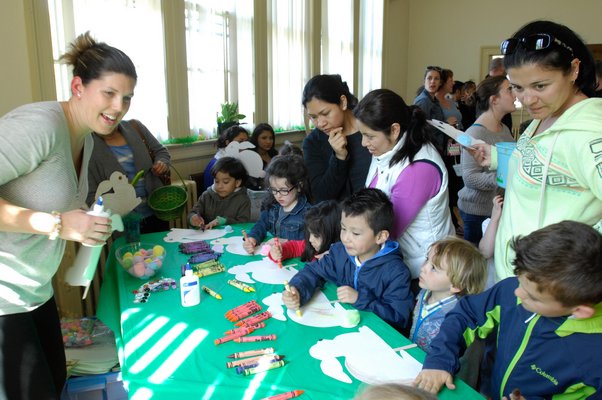 Children color bunnies at the North Sea Community Assocition Easter party and egg hunt on Sunday.