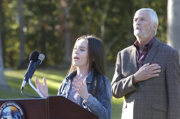 Lindsay Dunn from Hampton Bays High School performs the National Anthem at the dedication of Good Ground Park on Friday evening
